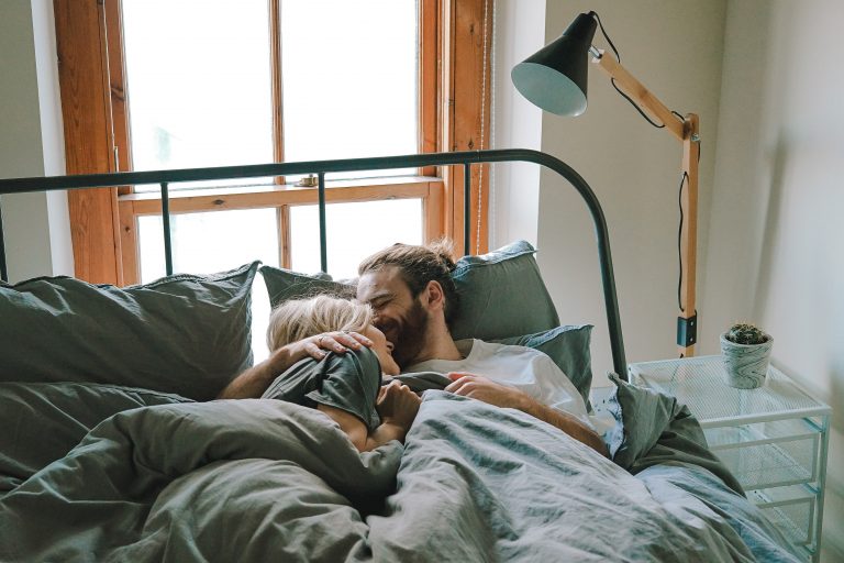 MAN AND WOMAN INTIMATE IN BED