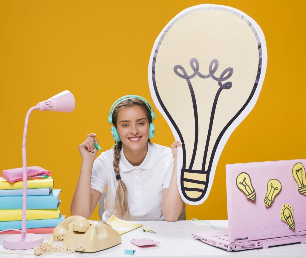 girl with dyslexia listen to audio instructions on a head phone