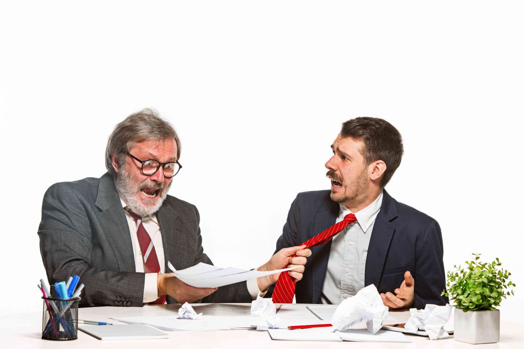 one man holding another mans tie in anger 