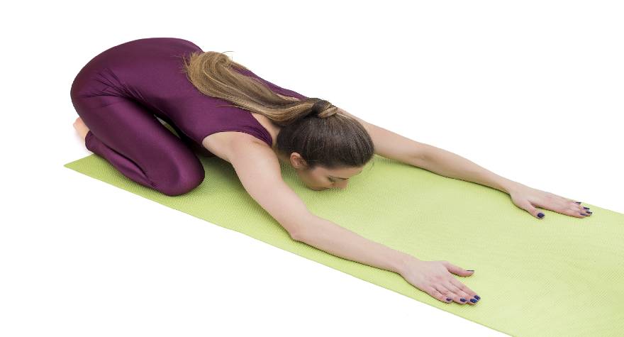 a person stretching on a mat
