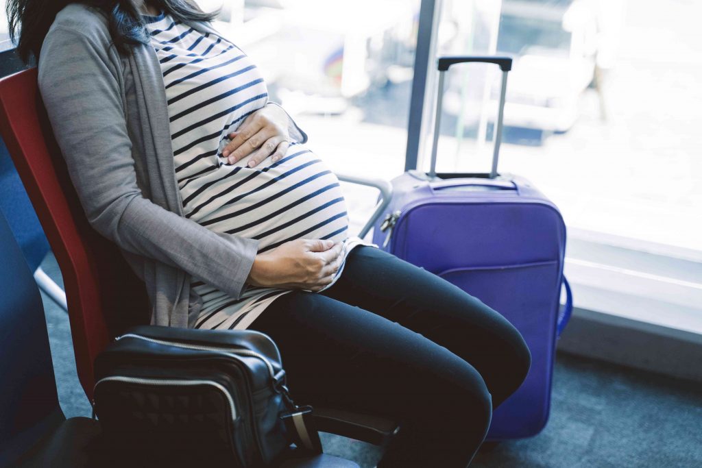 full term pregnant woman sitting in the bus 