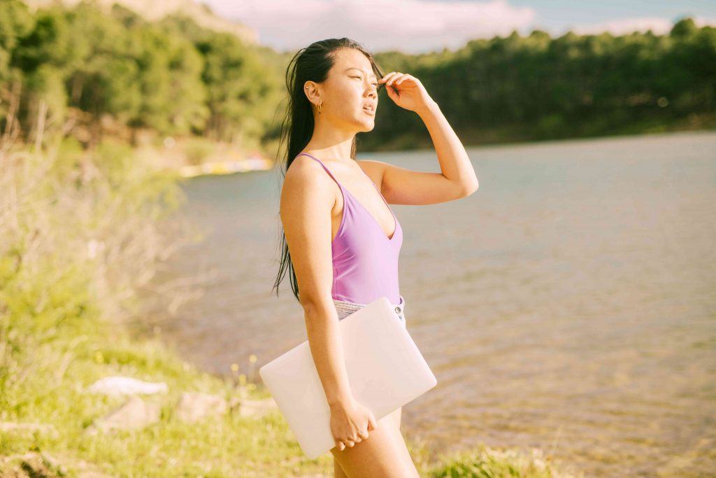 woman with a file in hand, out in the sun