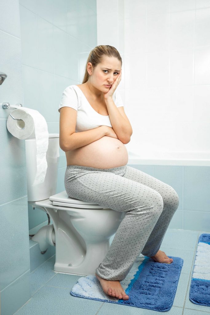 anxious woman worried if her water broke, anxious about impending delivery of baby