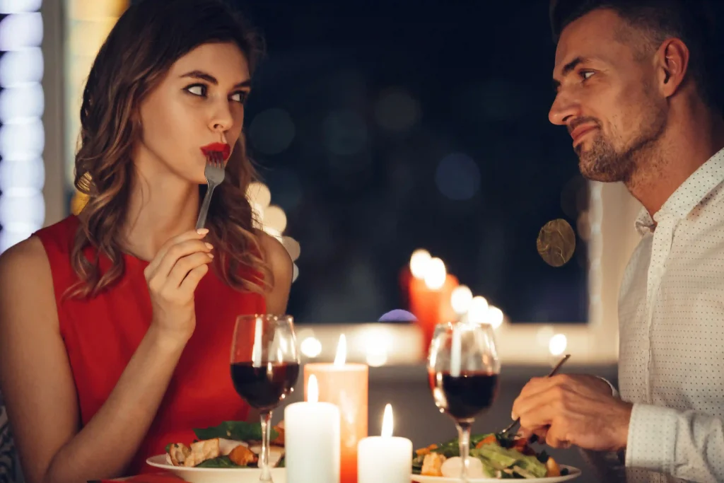 MAN TAKING HIS WIFE ON A ROMANTIC CANDLE LIT DINNER TO A RESTAURANT