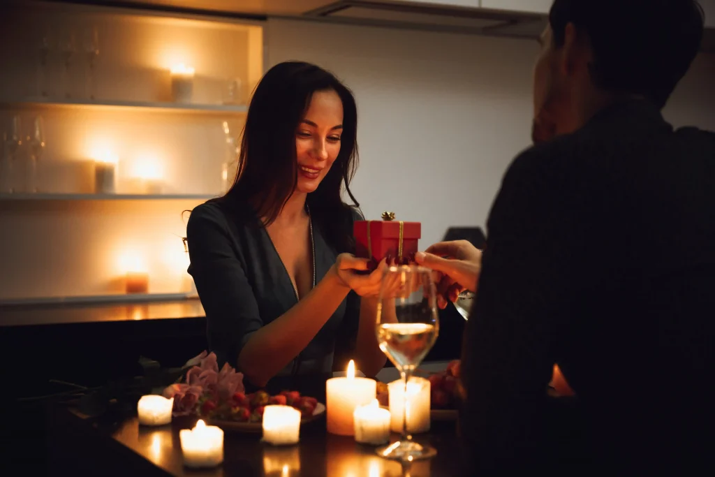 woman and man having romantic candle-lit dinner 